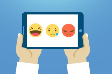 Tablet con tres emoticones para trabajar inteligencia emocional