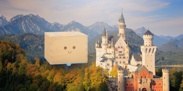 Imagen de un castillo en una montaña con el robot, Cubetto se va de vacaciones