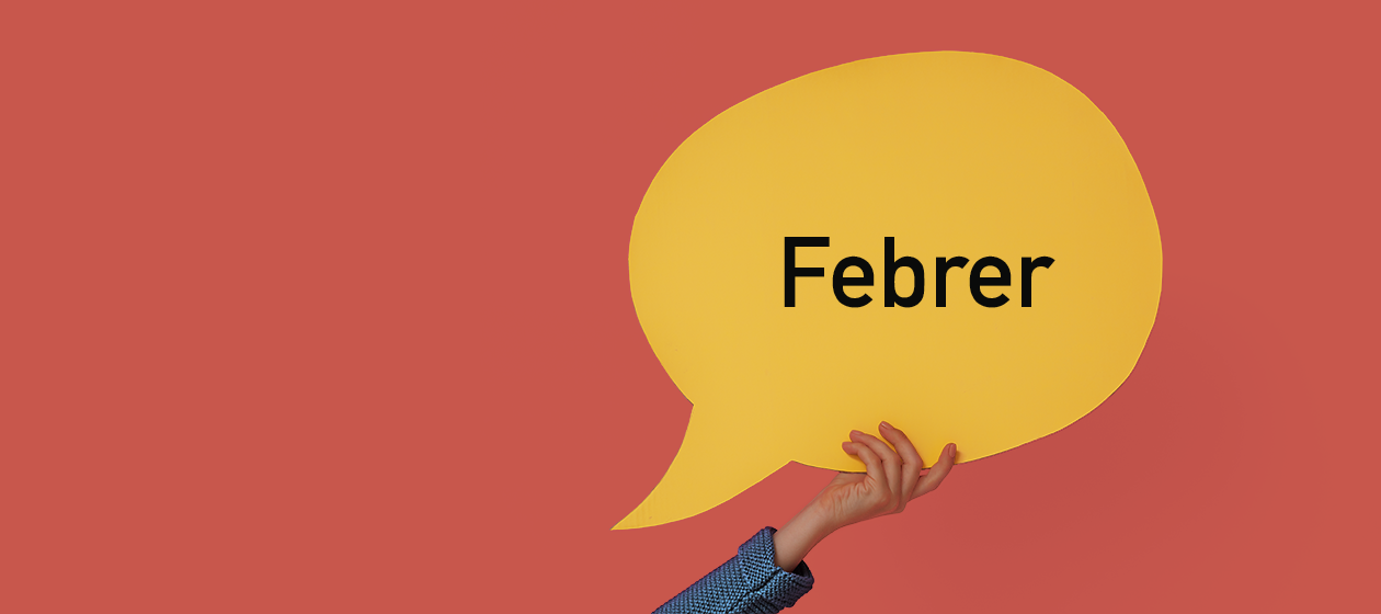 globus groc sobre fons vermell amb paraula febrer per a frases d'educació del mes de febrer